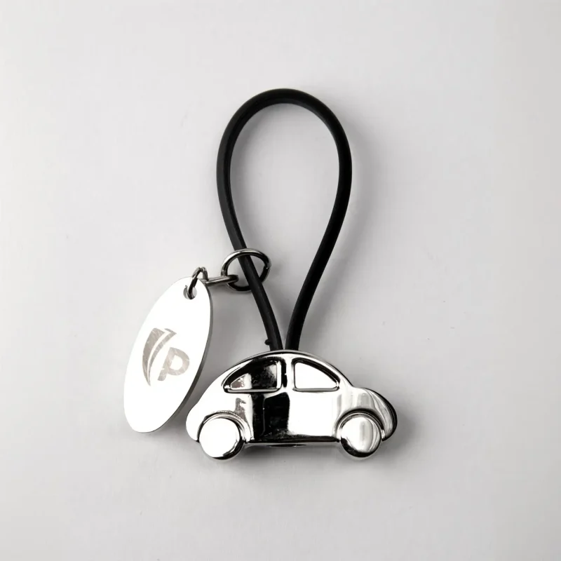Llavero metálico en forma de carro
